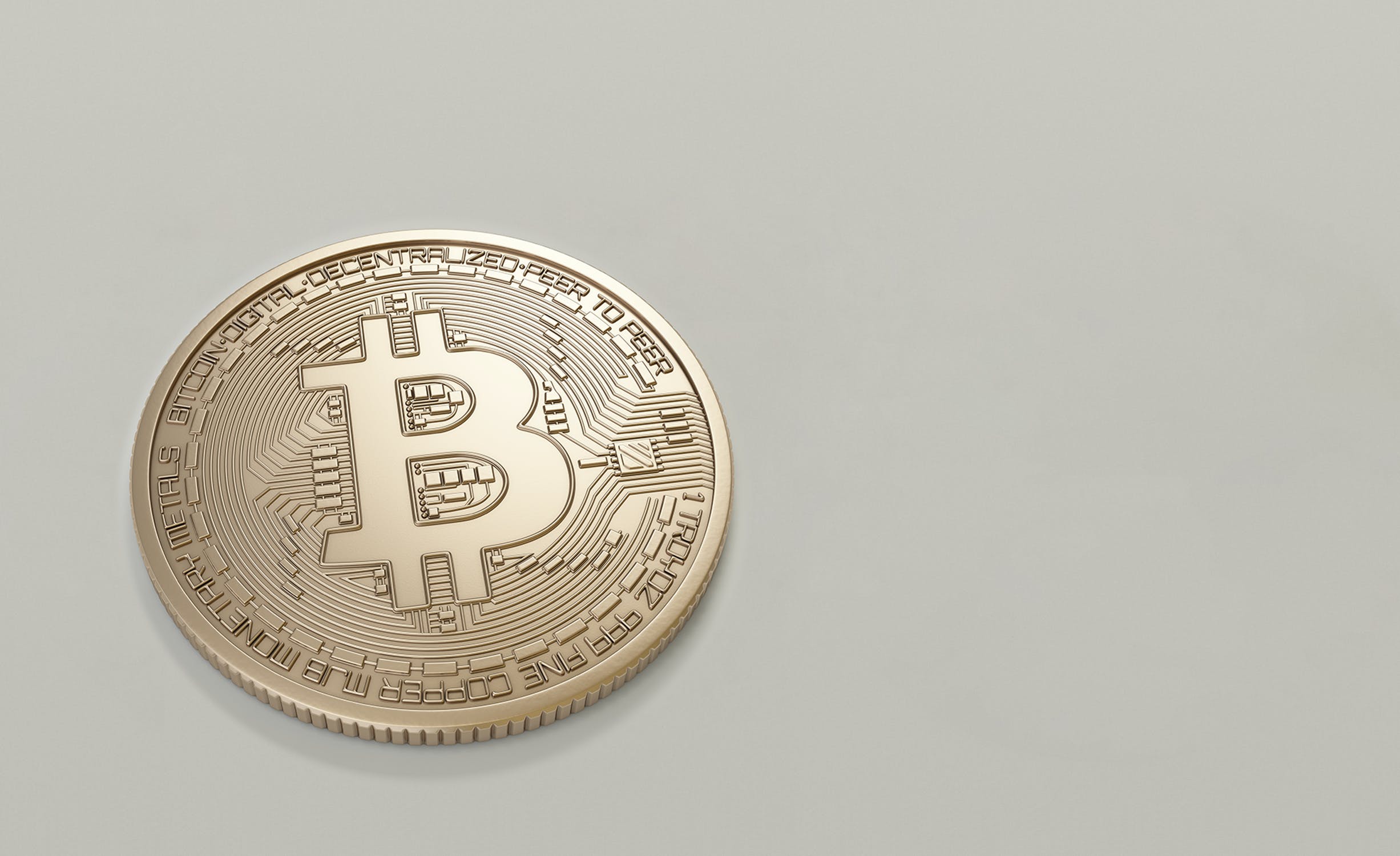 bitcoin bronze coin on empty grey background